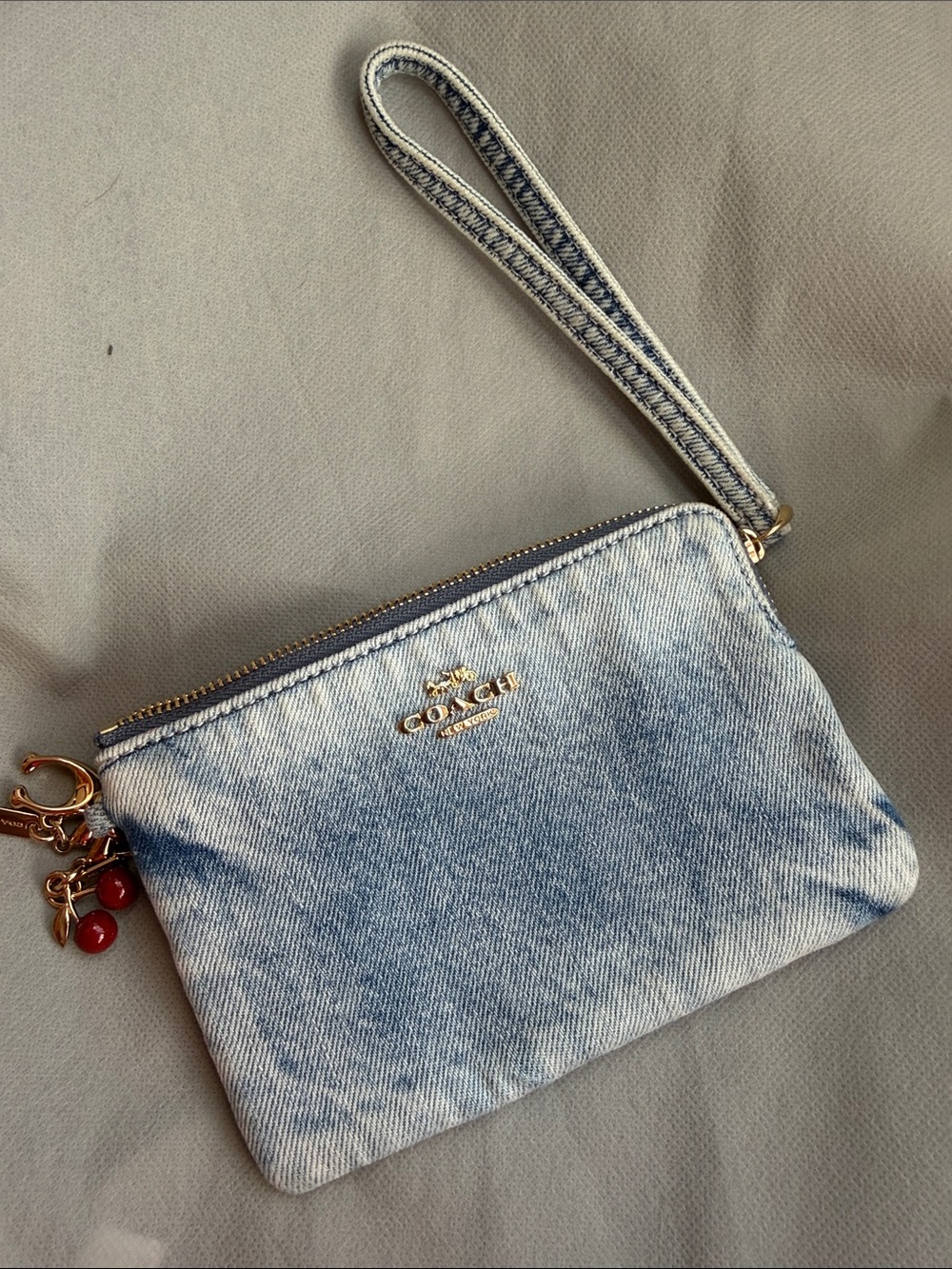 COACH Light Blue Denim Wristlet with Gold Hardware